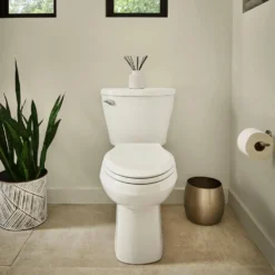 American Standard Reliant Two-Piece 1.28 GPF Single Flush Elongated Standard Height Toilet With Slow-Close Seat In White -The Home Depot white american standard two piece toilets 773ca101 020 66 1000